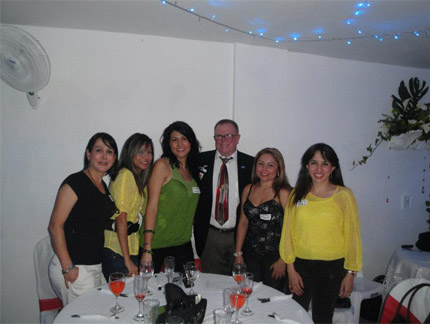 A smiling client with the beautiful, Colombian brides